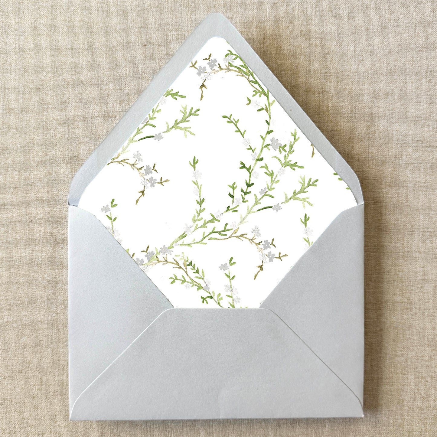 White Floral Envelope Liner on linen background