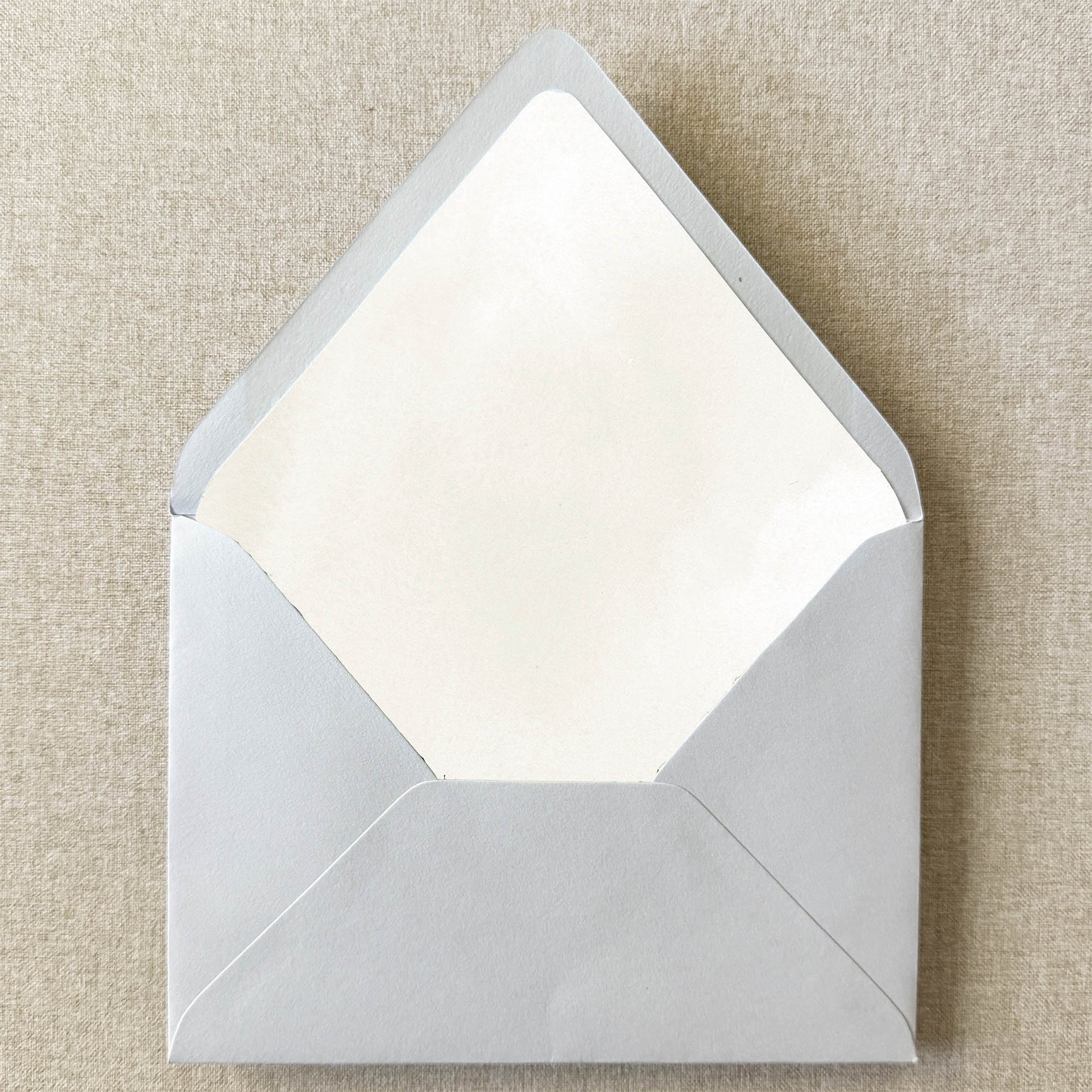 Ivory Cream Watercolor Envelope Liner on linen background