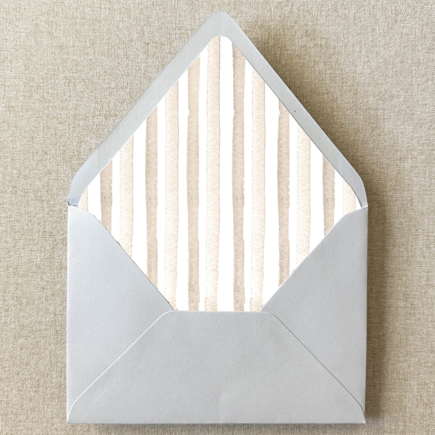 Neutral Beige Stripe Envelope Liner on linen background