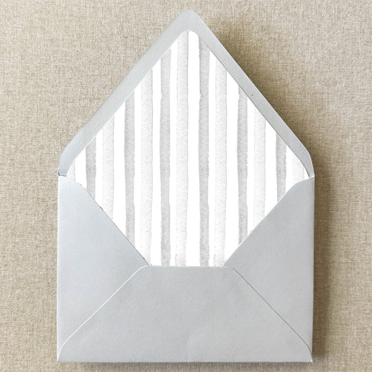 Grey Stripe Envelope Liner on linen background