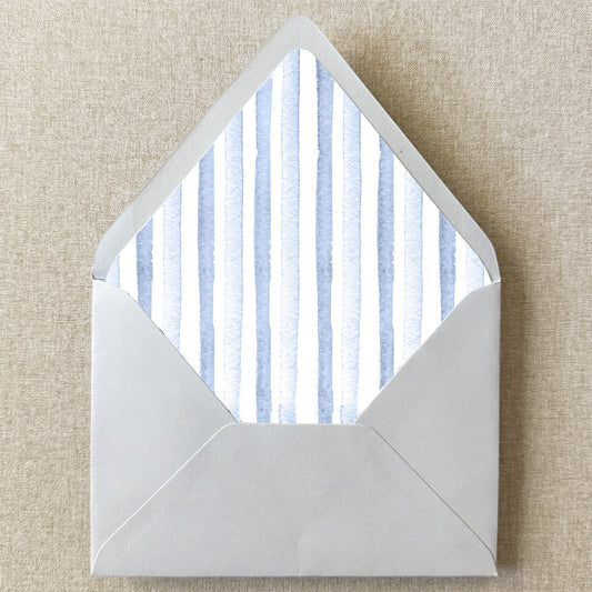 Dusty Blue Stripe Envelope Liner on linen background