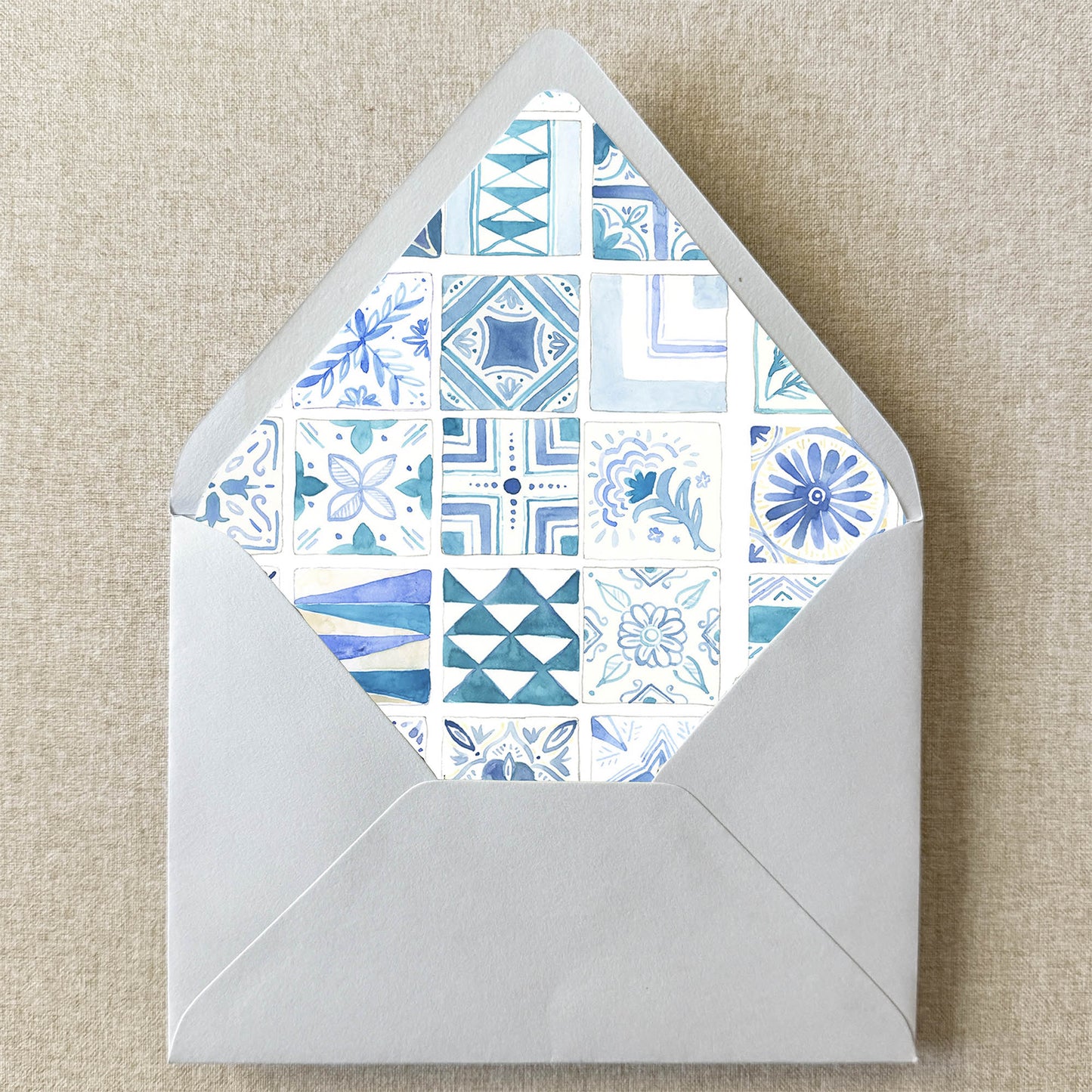 Blue Mexican Mediterranean Tile Envelope Liner on linen background