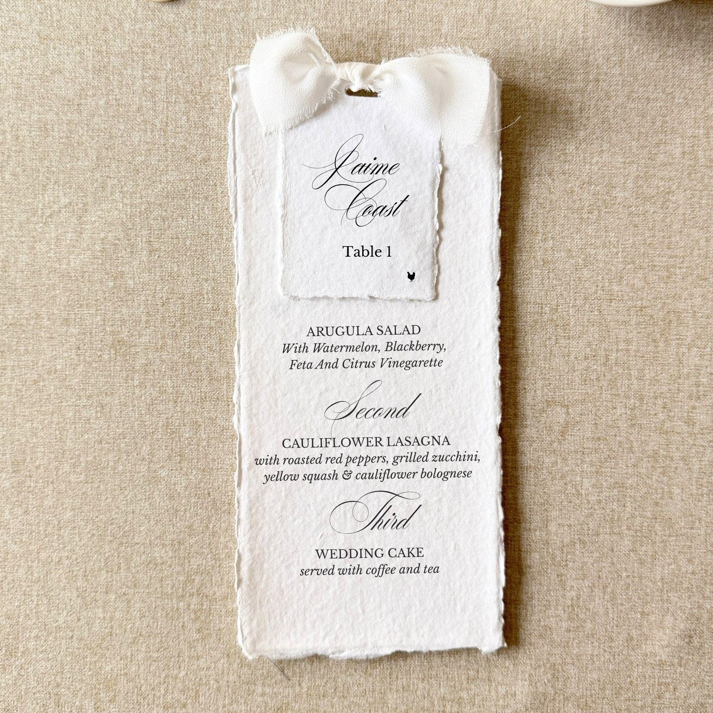 White wedding menus tied with a bow and name cards on handmade paper, set of 10
