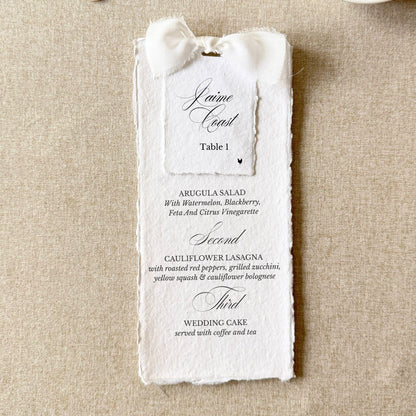 White wedding menus tied with a bow and name cards on handmade paper, set of 10