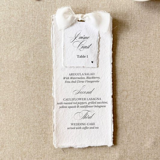 White wedding menus tied with a bow and name cards on handmade paper, set of 10